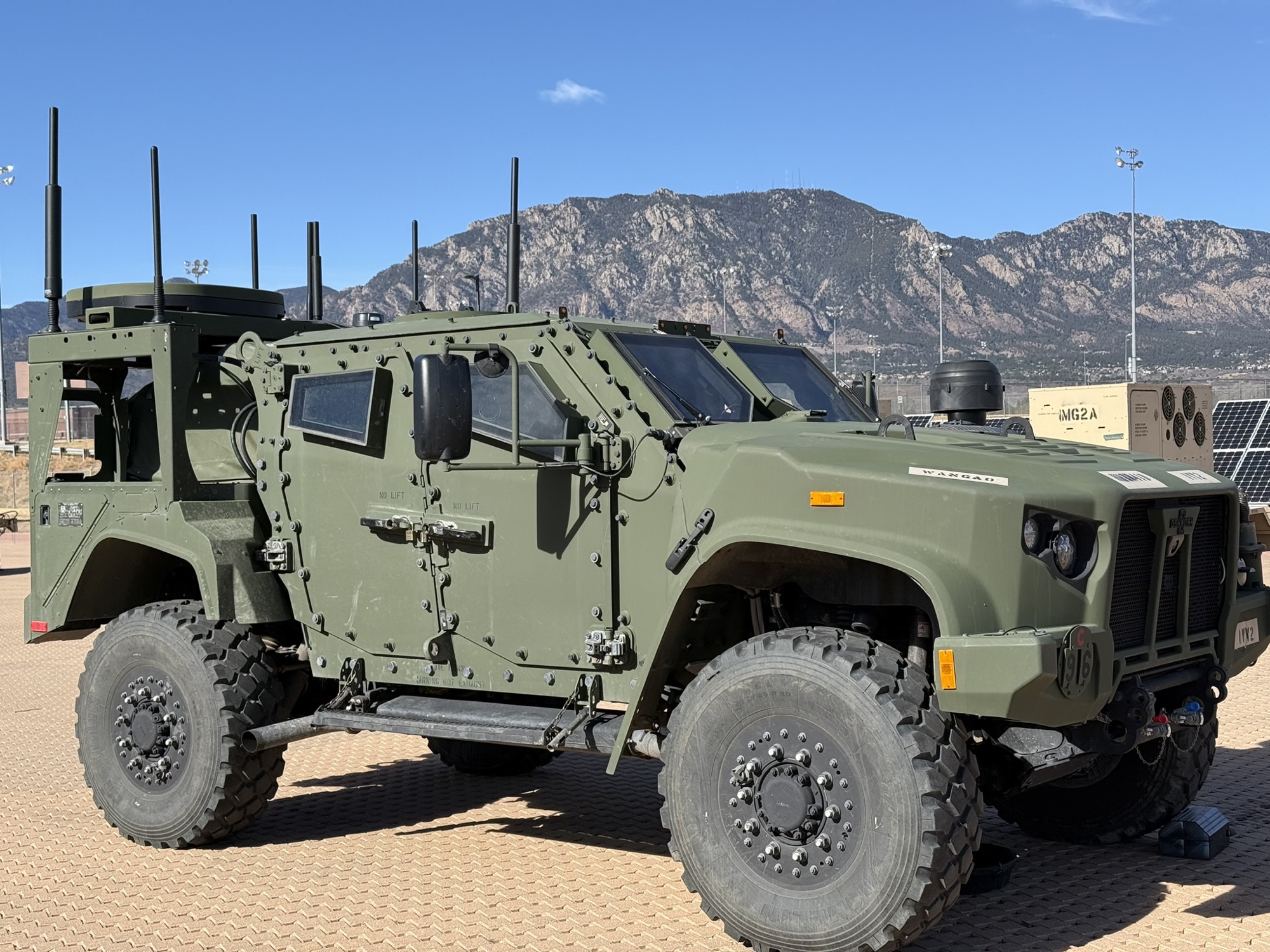 Army JLTV fitted with antennas and a satellite terminal