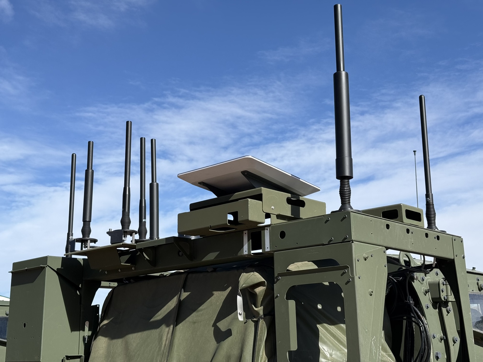 Close view of vehicle-mounted antennas and a Starshield terminal
